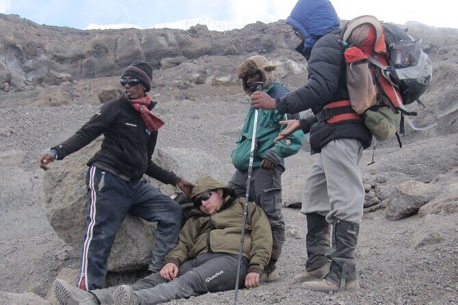 7 Days Kilimanjaro via Machame route affordable price - Day 6 Descent: Mweka Gate, Certificates, Mud, and the Hot Shower Moment
