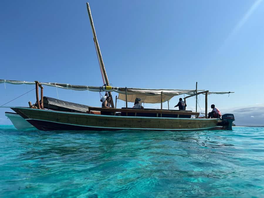 Matemwe: Mnemba Island Dolphin & Snorkeling Boat Trip - Timing, getting to The Mora beach, and the shared-trip wait