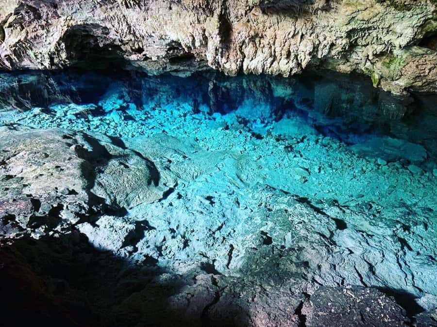 Zanzibar: Mnemba Island Atoll Guided Day Trip - Kuza Cave swimming in Jambiani for a heat reset